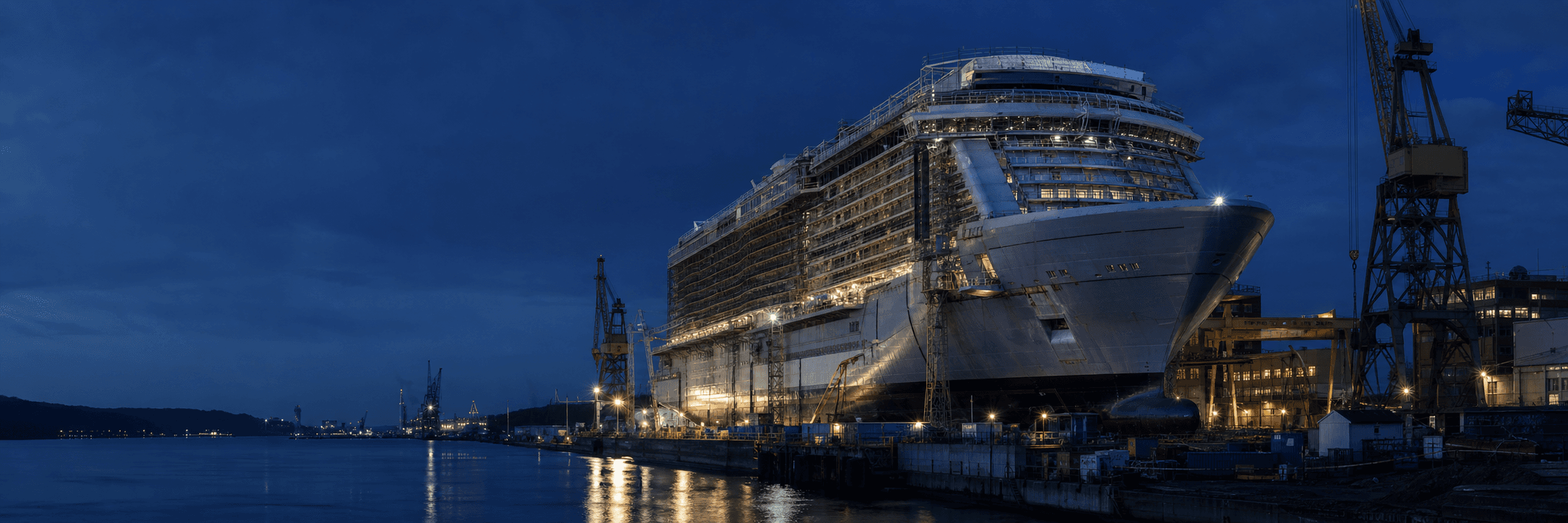 Large cruise ship undergoing construction at an international shipyard