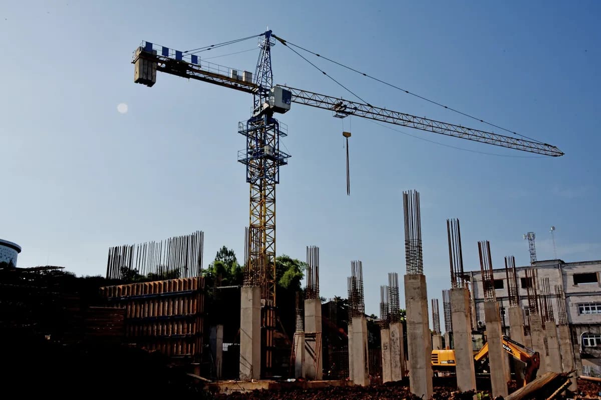 Commercial building construction site with tower crane